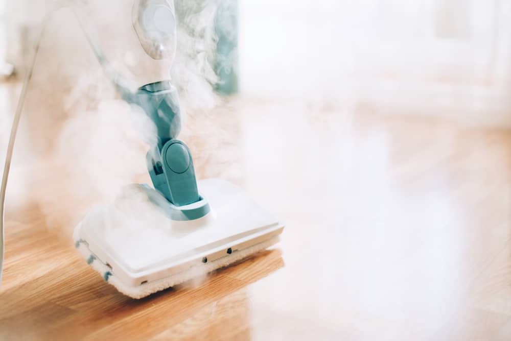 Steam cleaner mop cleaining floor