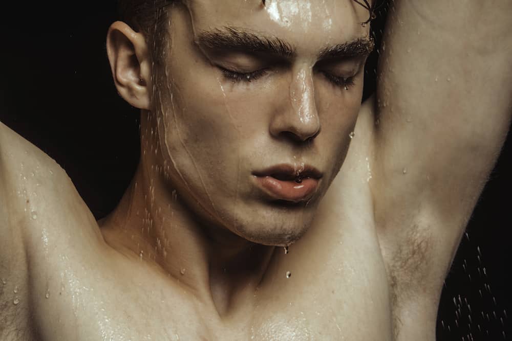 Handsome wet sport sexy stripped guy portrait
